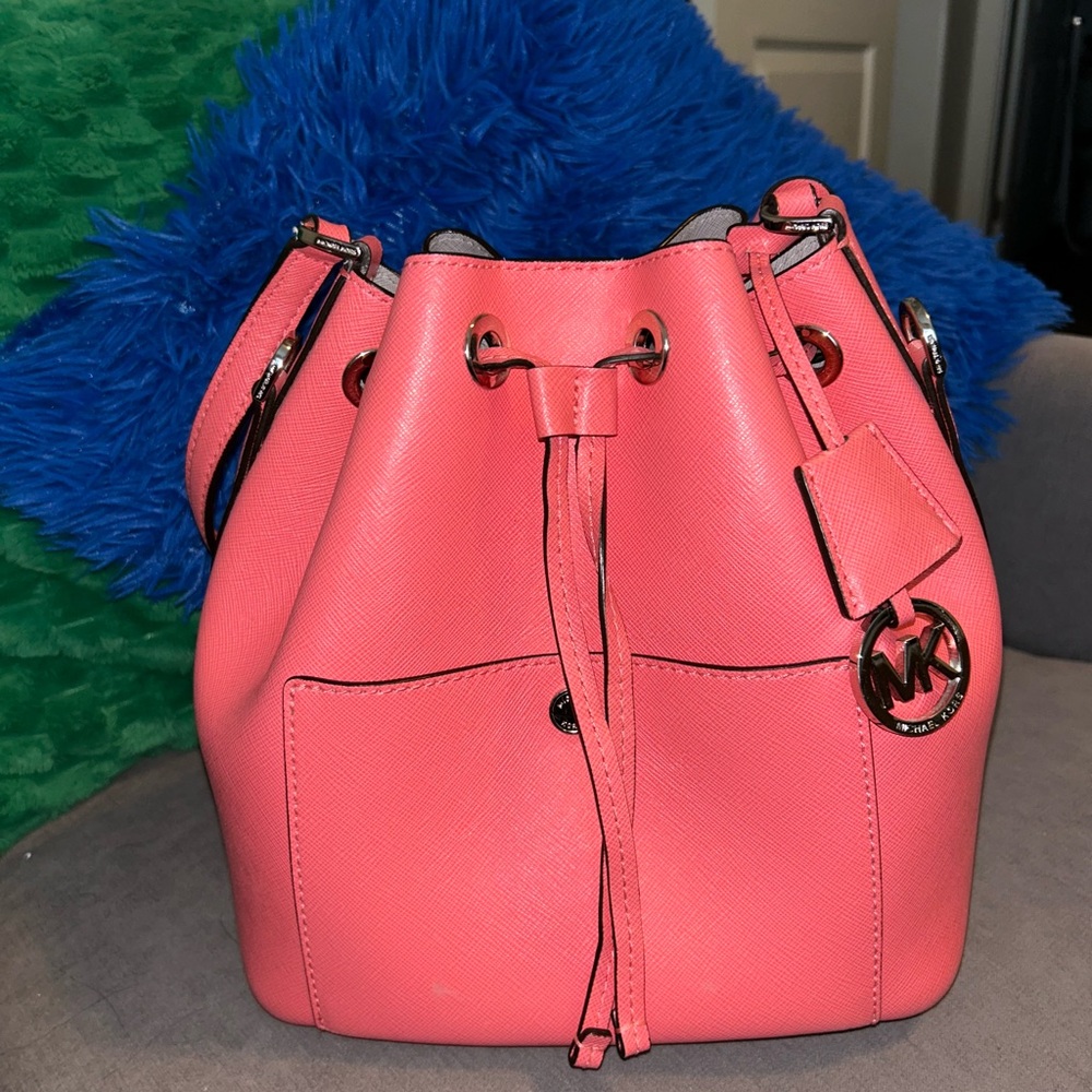 Michael Kors salmon bucket bag.